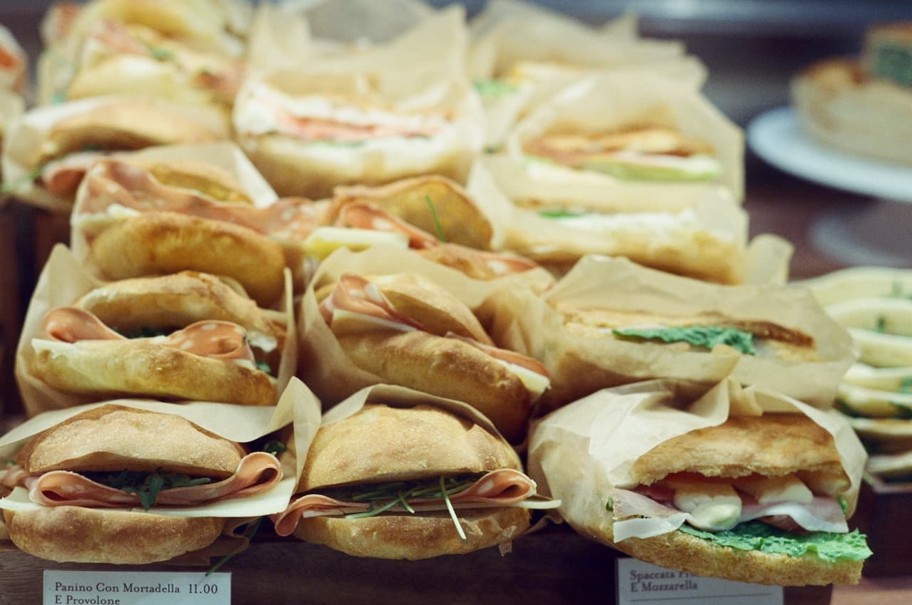 Italian deli sandwiches in a display case