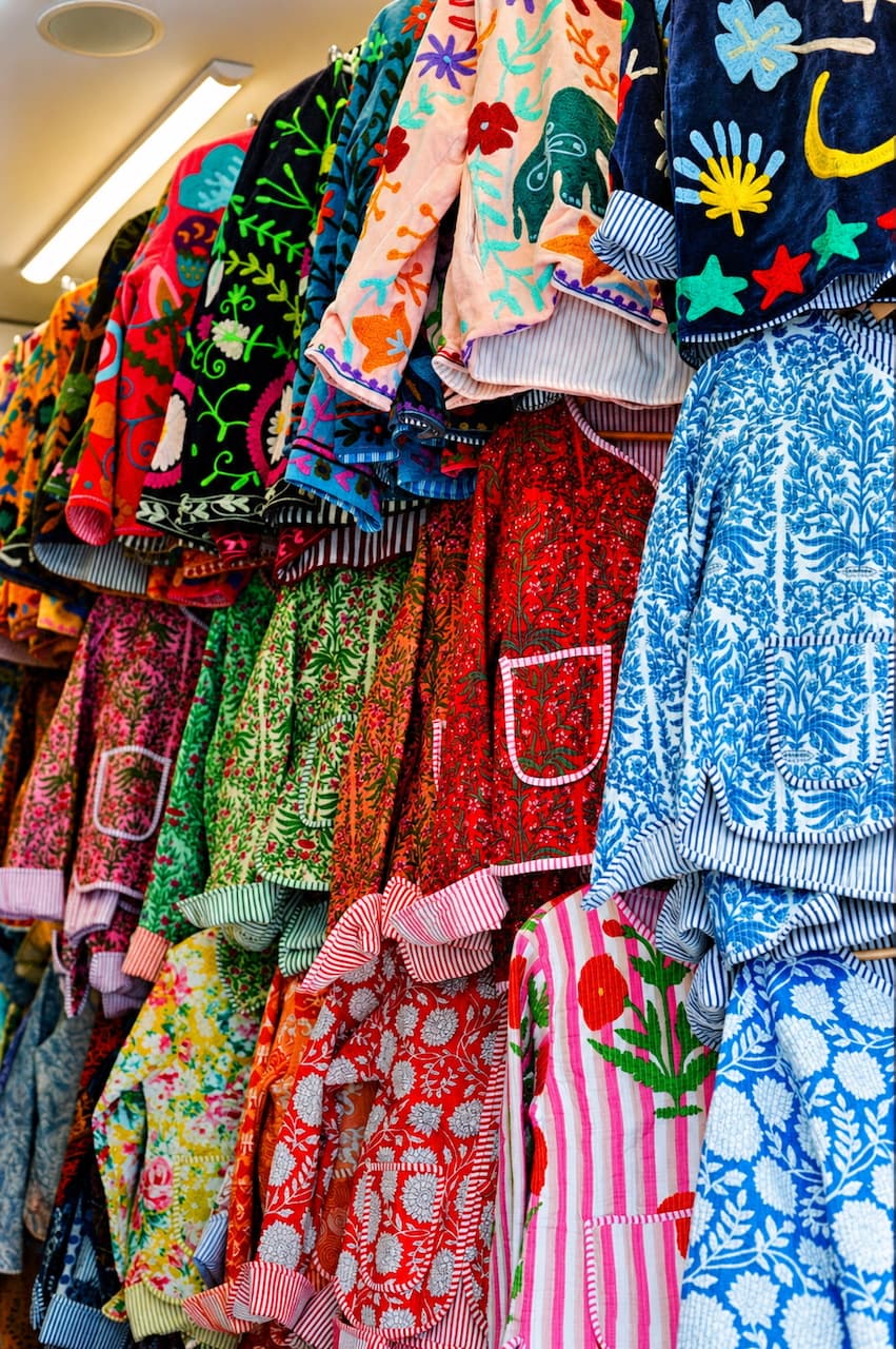 Patterned aprons hanging on display in a market