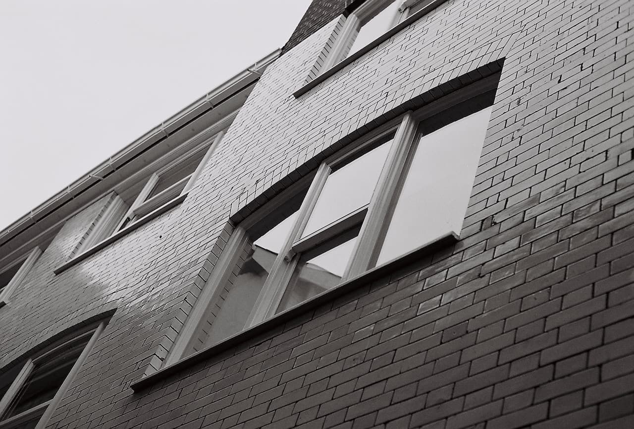 Looking up at the gable end of a brick building